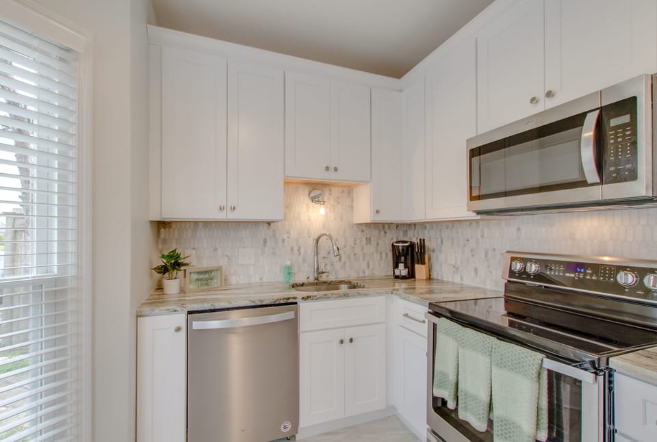 The kitchen features stainless steel appliances