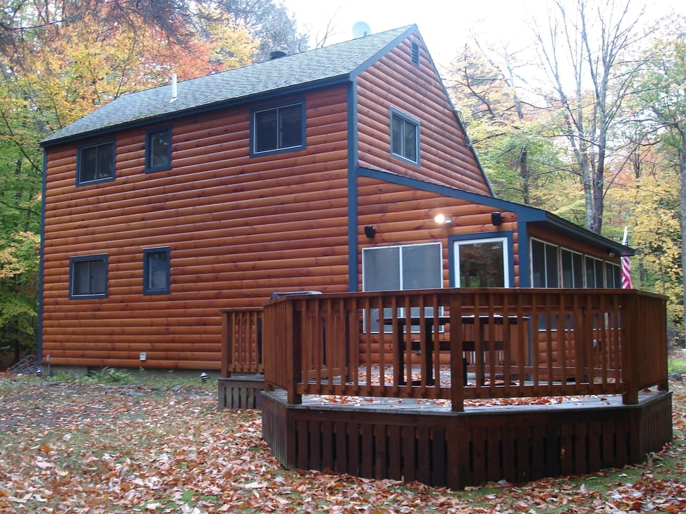 rear of the house with deck and grill