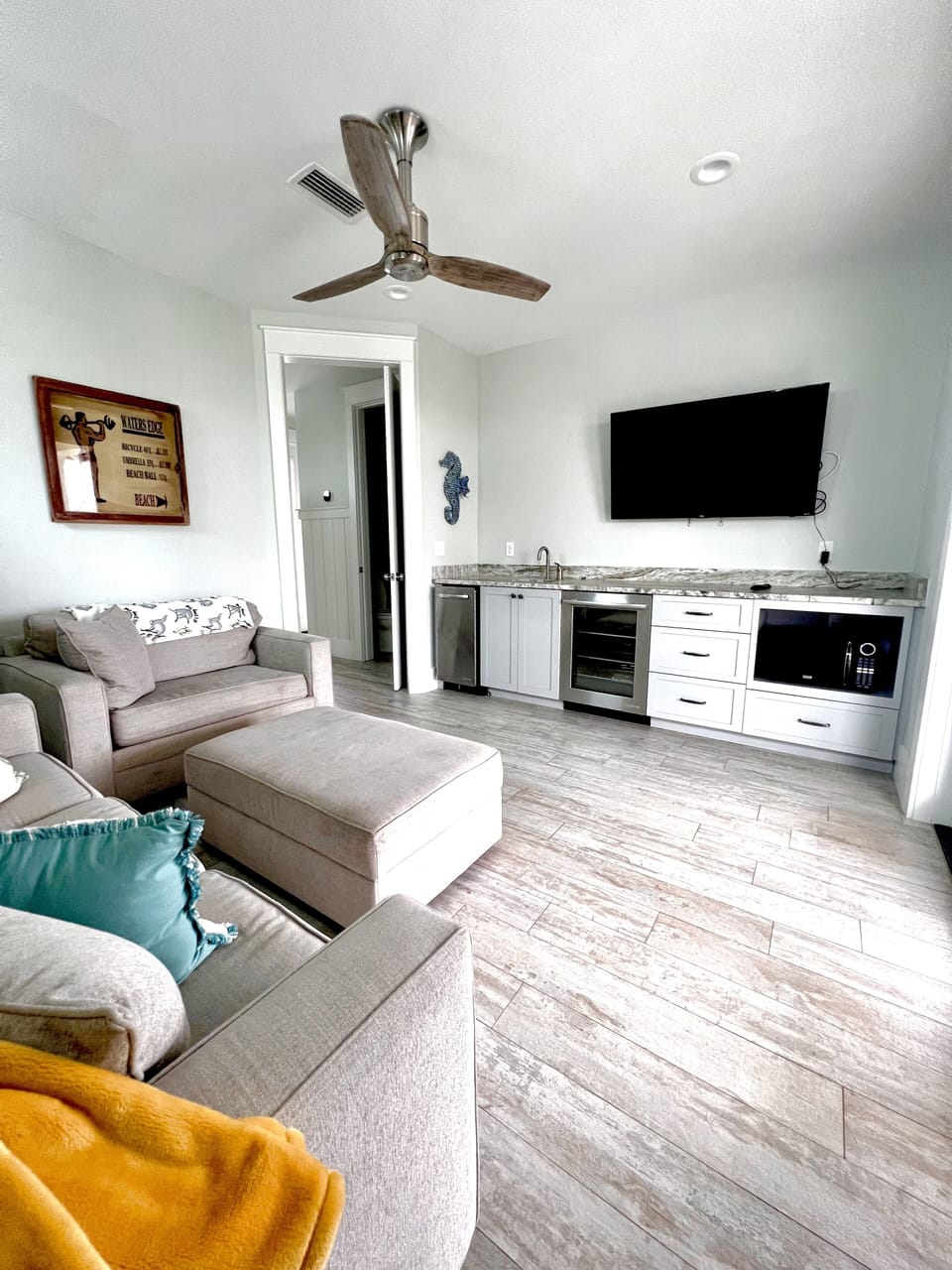 Third floor media room with ice maker & beverage fridge. Awesome decks too!