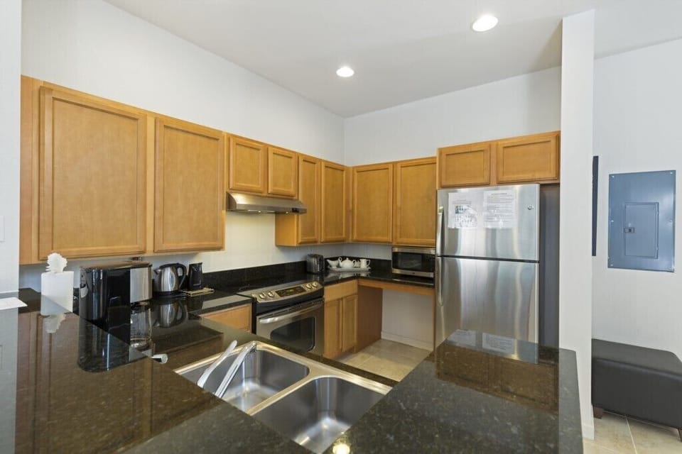Bright and functional kitchen area with sleek countertops and plenty of storage.