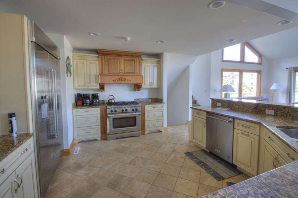 Kitchen Aid range and huge stainless fridge has everything you need for 16 people.