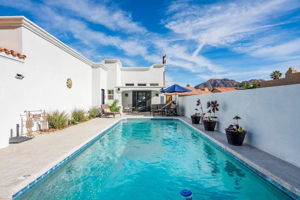 Lovely relaxing pool with seating and umbrella