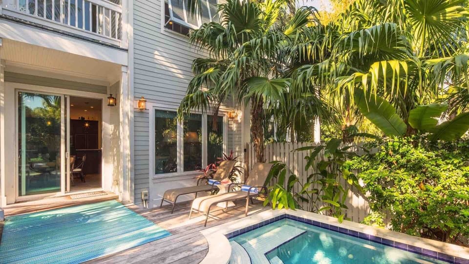 The private saltwater dip pool is heat-optional and surrounded by lush landscaping...