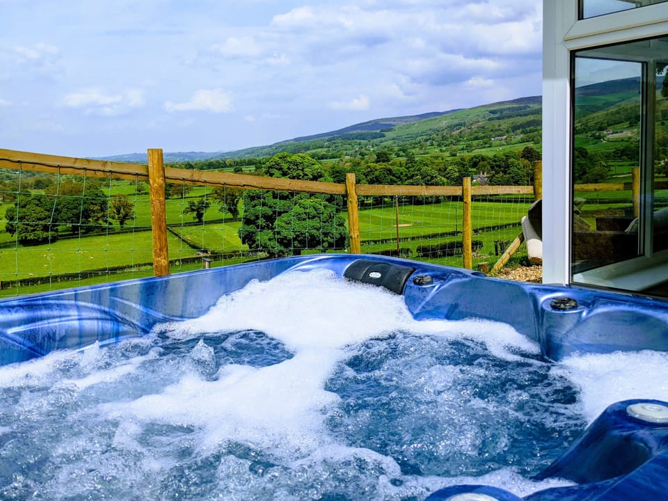 Relax in the hot tub whilst taking in the stunning views