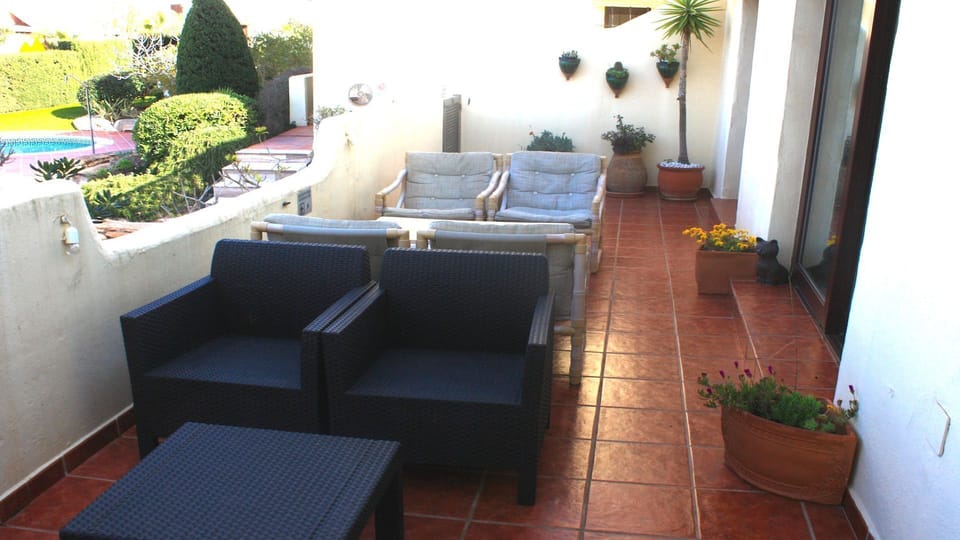 Terrace overlooking pool. Ideal for supervising children