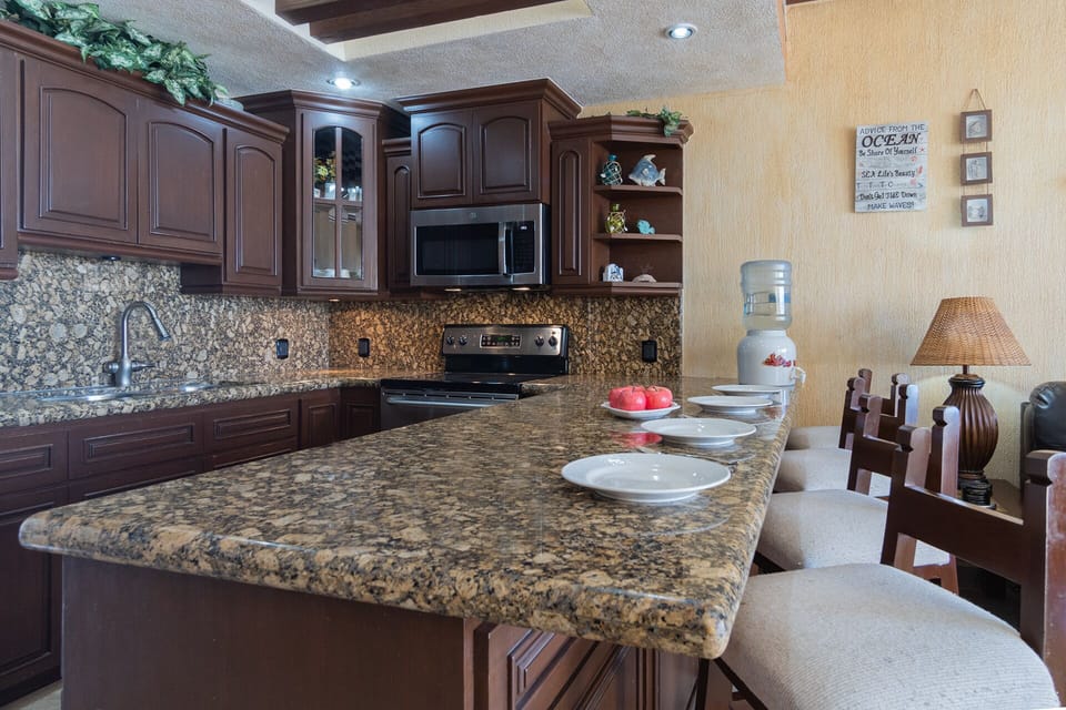 The counter at the kitchen is a great spot for a quick snack.