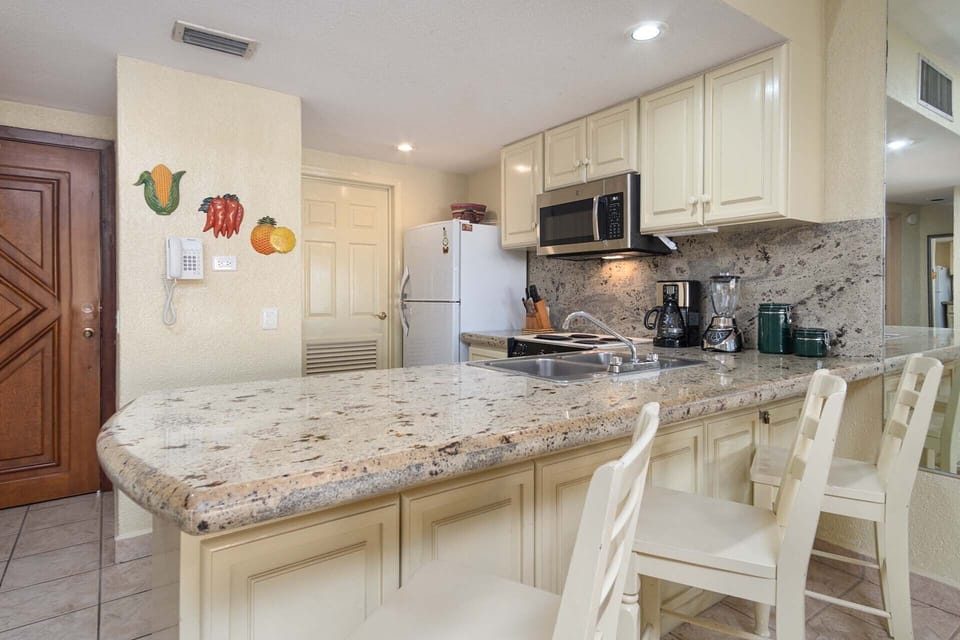 Elegant kitchen counter and extra seating.