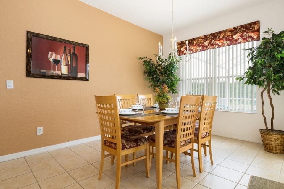 Elegant dining space with a view of the outdoors for a cozy ambiance.