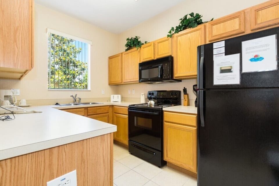 Fully equipped kitchen with modern appliances for home-cooked meals.
