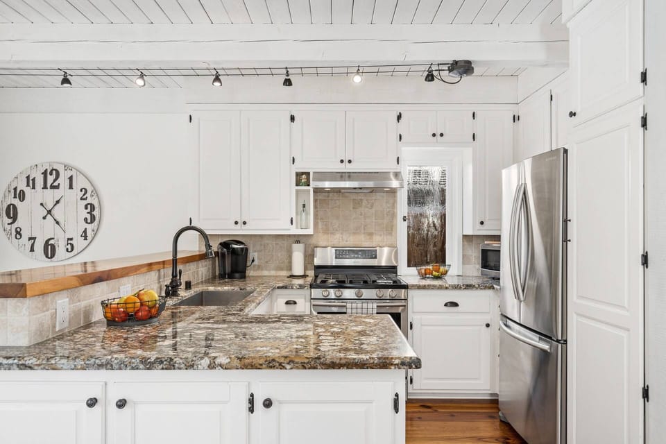 Updated kitchen with new appliances and well stocked with cooking essentials
