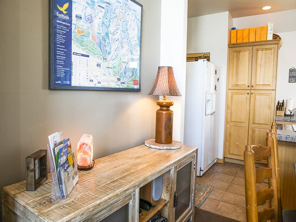Interior Dining Area with Refrigerator - Interior dining area side table/shelf with Refrigerator in background.