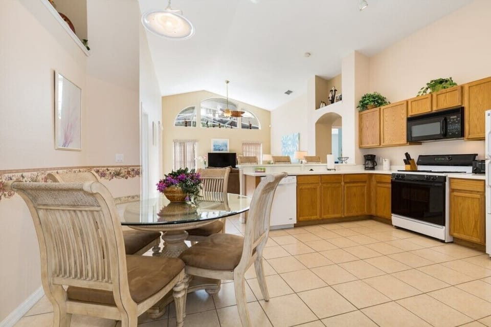 Spacious dining area with elegant furnishings, ideal for enjoying meals with family and friends.