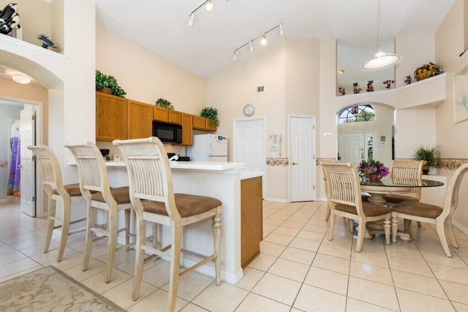 Modern breakfast bar with comfortable seating and ample counter space for quick meals.