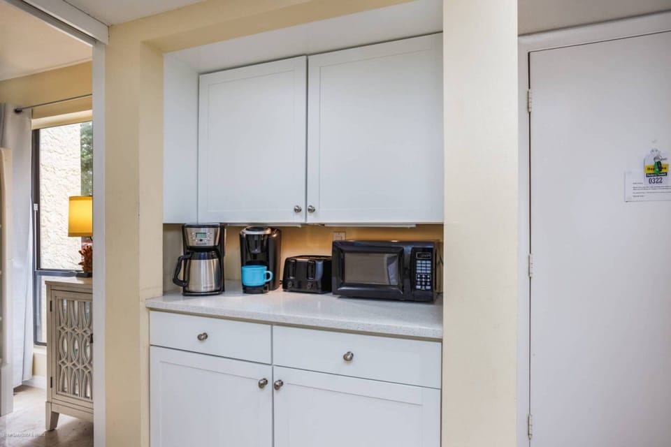 How about that.....a coffee bar off the kitchen.  Both a Keurig and regular brew.