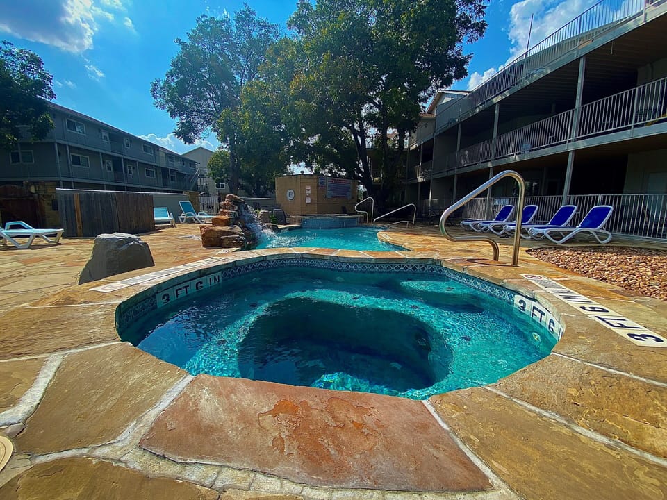 Pool with two hot tubs