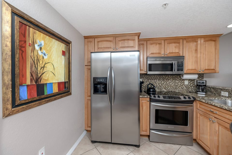 Kitchen Features Stainless Steel Appliances and Granite Countertops