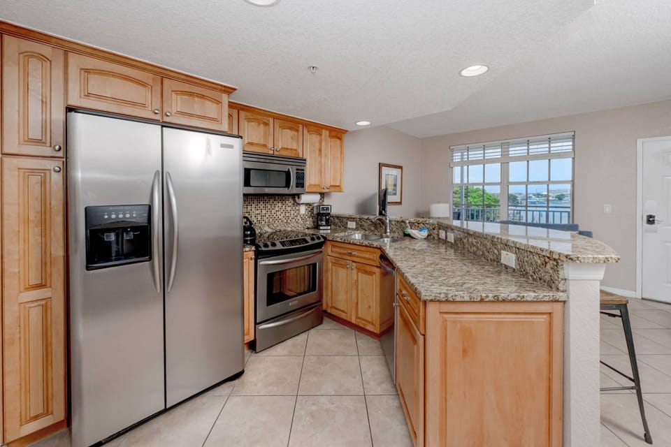 Kitchen Features Stainless Steel Appliances and Granite Countertops