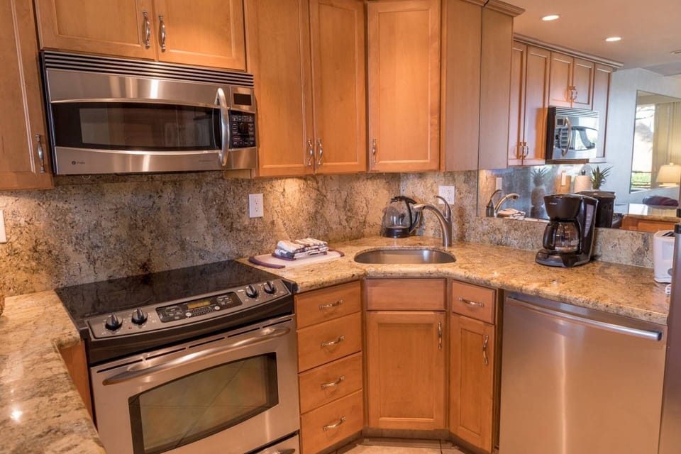 Stainless steel appliances including a dishwasher and microwave