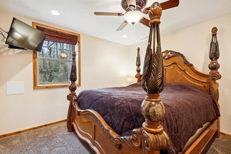 Bedroom 4 - Lower Level - King Size Bed. Goes out to recreation Room. Linens and sheets provided and professionally cleaned.
