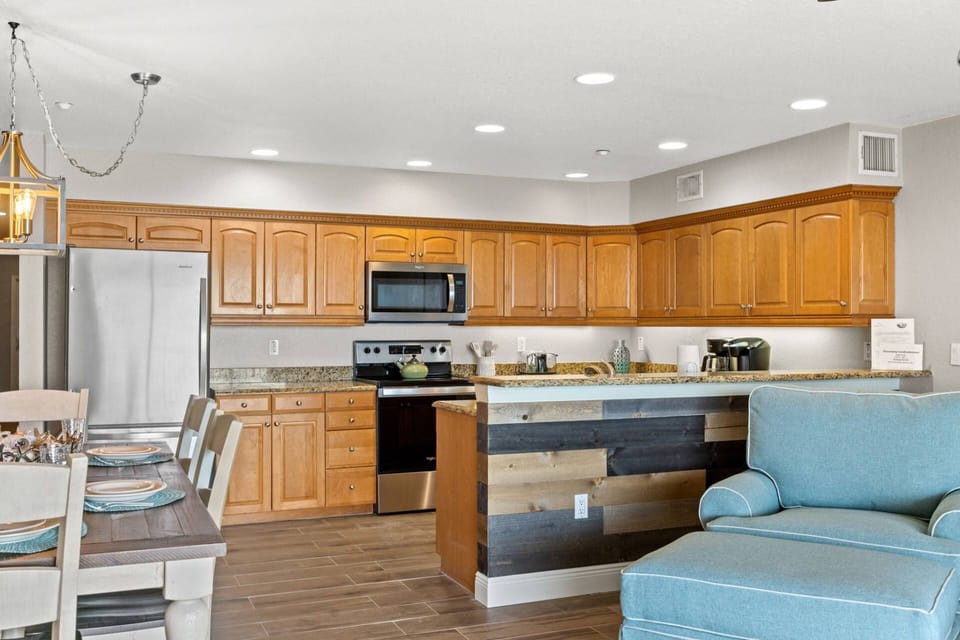 Fully Equipped Kitchen Opens up to the Living and Dining Areas