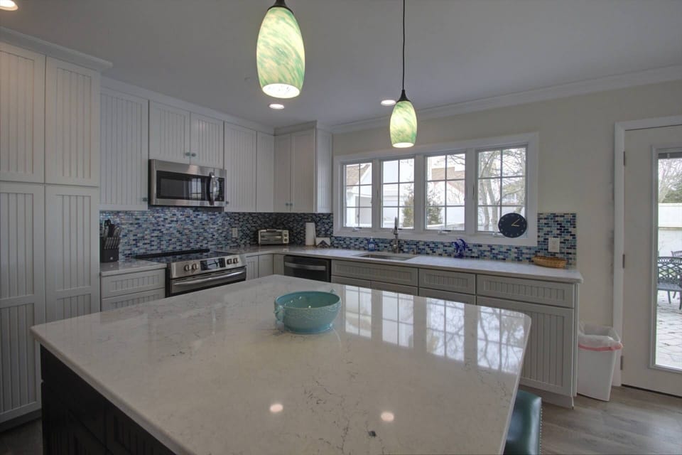 New lighting, flooring, custom cabinetry, and counter tops to enjoy on your vacation.