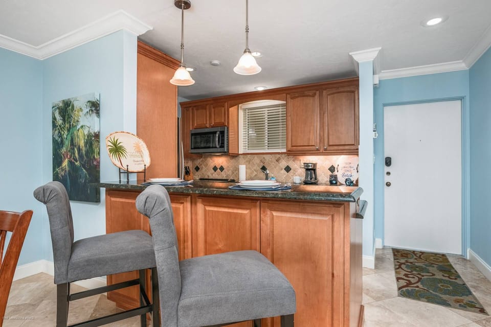 Granite counter seating for 2 on soft, comfy chairs