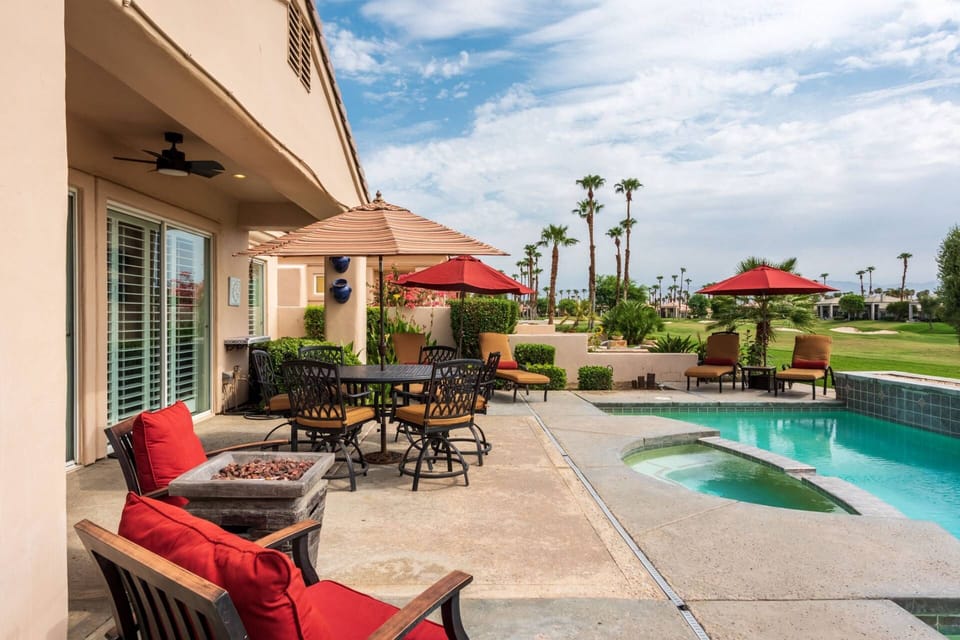 Patio and Pool Area - seating of 6 on round table - 3 chairs, 4 lounge chairs, and an umbrella