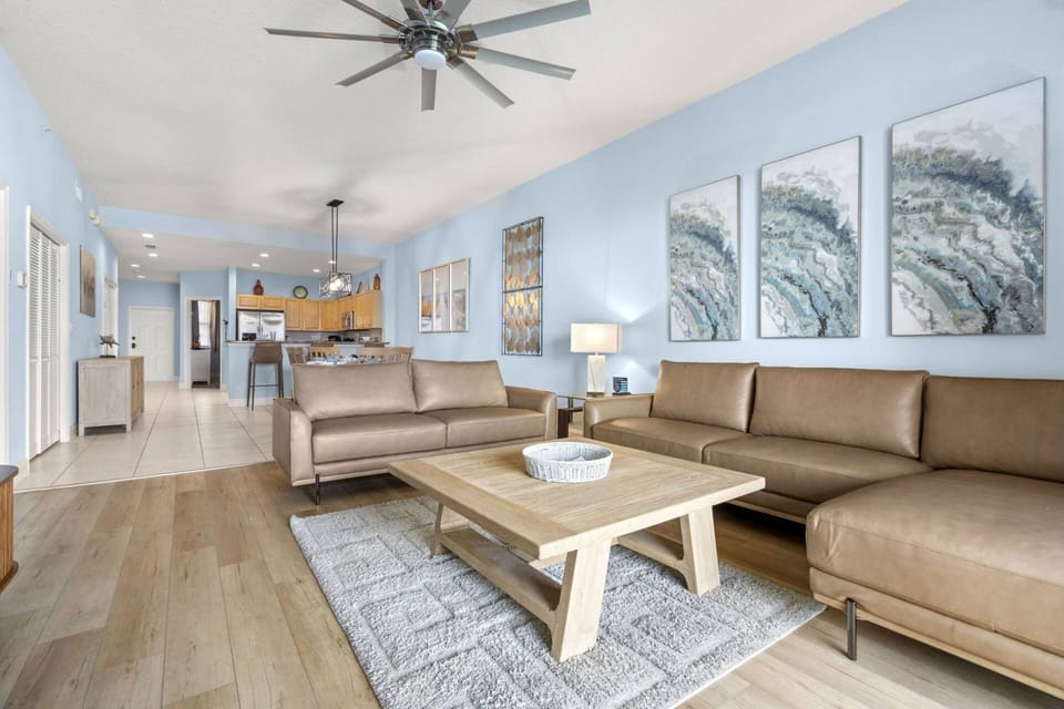 Updated Living Room with Leather Sofa and Loveseat