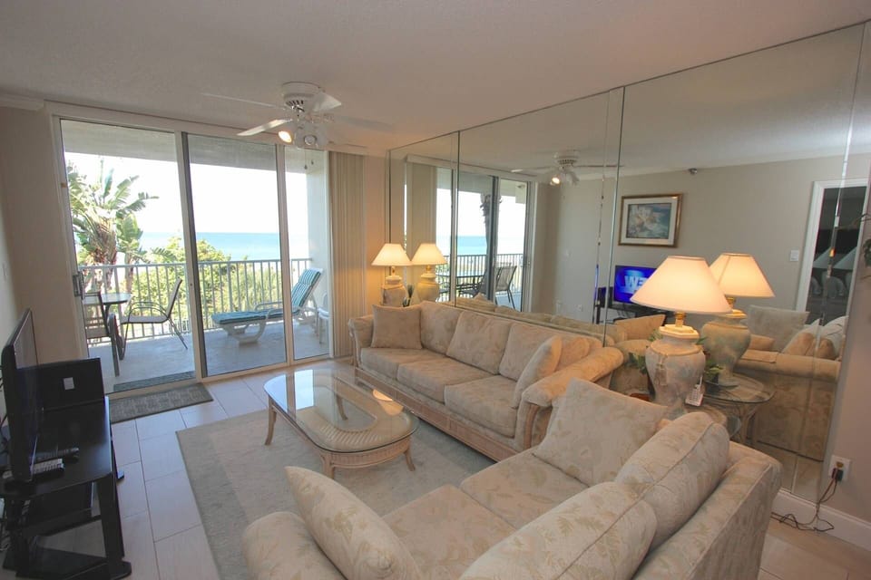 Open Living Area with Sleeper Sofa/Cable TV/Private Patio with Seating for 4 overlooking the Beautiful Gulf of Mexico