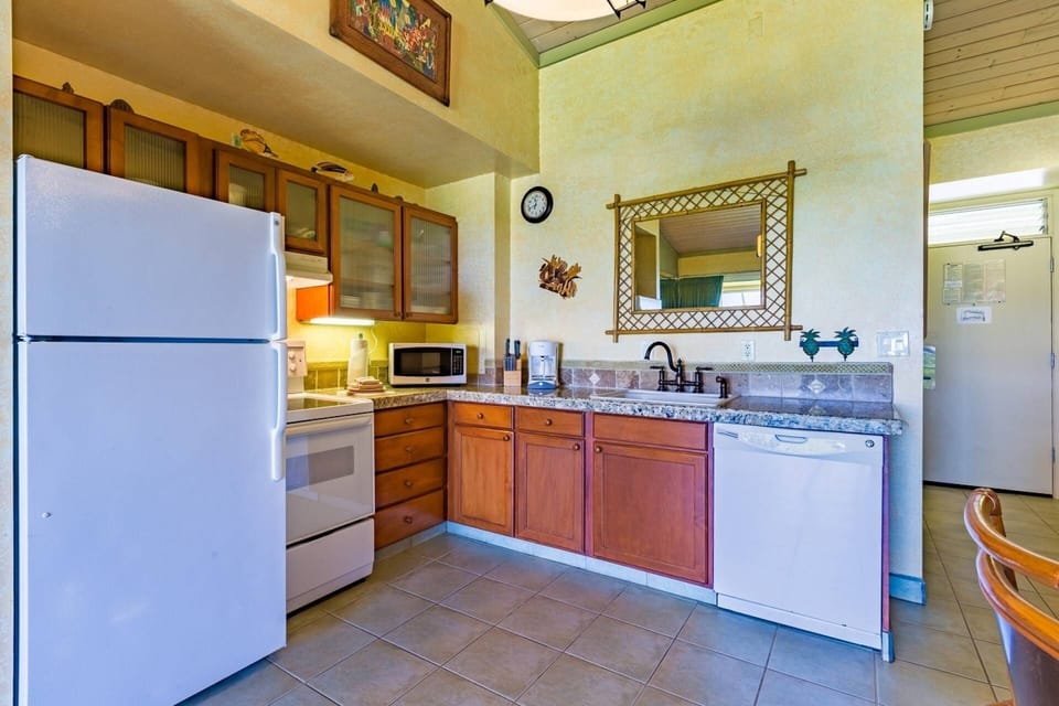 Full sized refrigerator and dishwasher.