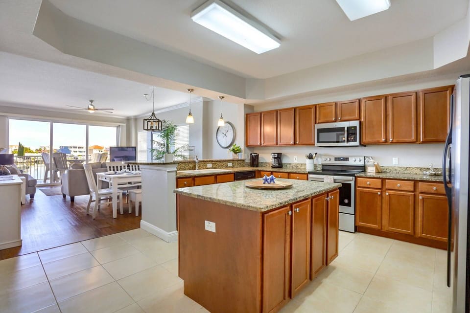 Gourmet Kitchen with Large Island, Granite Countertops and Stainless Steel Appliances