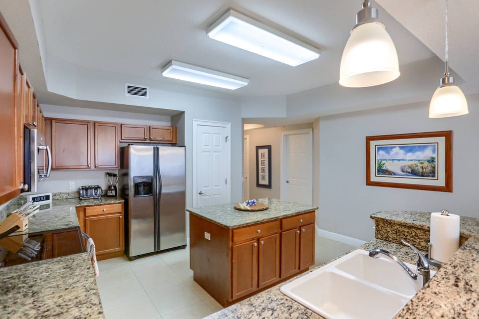 Gourmet Kitchen with Large Island, Granite Countertops and Stainless Steel Appliances
