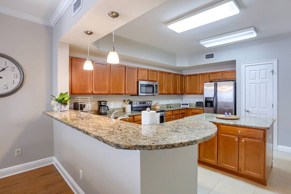 Gourmet Kitchen with Large Island, Granite Countertops and Stainless Steel Appliances