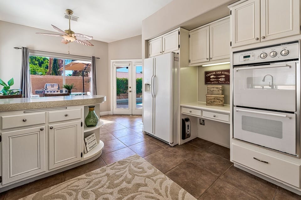 Well Equipped Kitchen with view of back yard