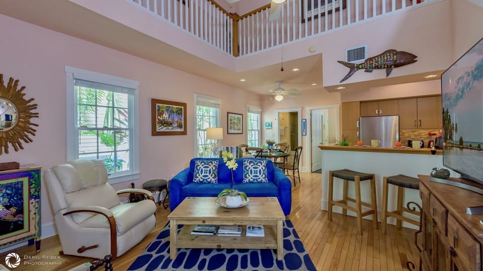 A flat screen Smart TV on the wall overlooks the spacious living area with plenty of seating...