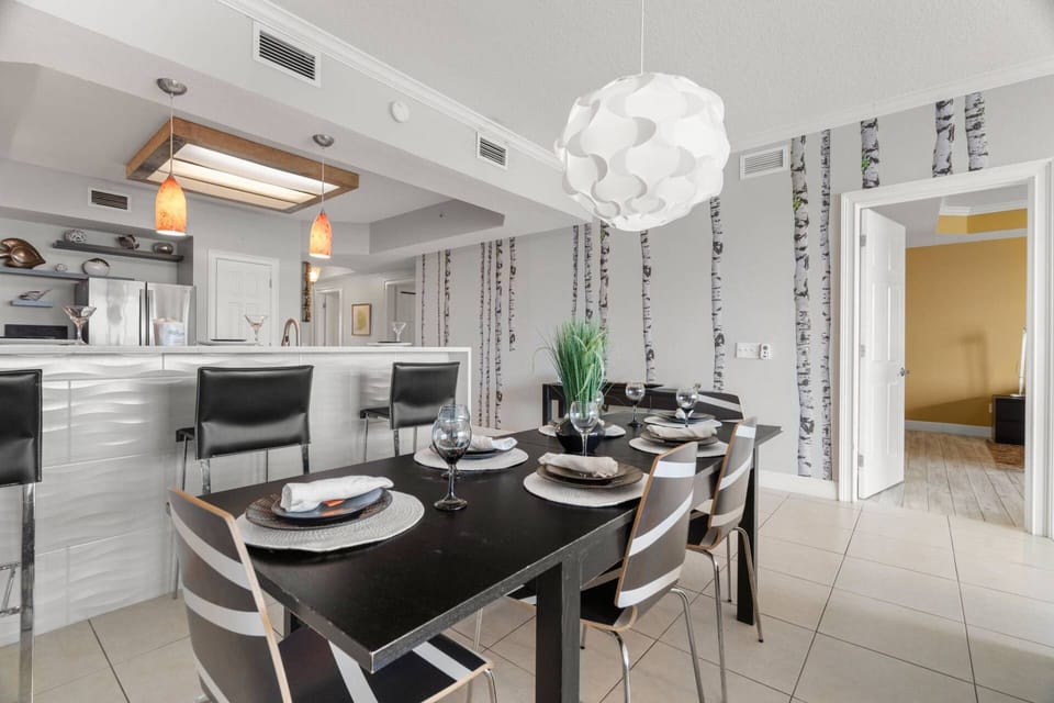 Dining Table with Seating for 6 with Additional Seating at Adjacent Breakfast Bar