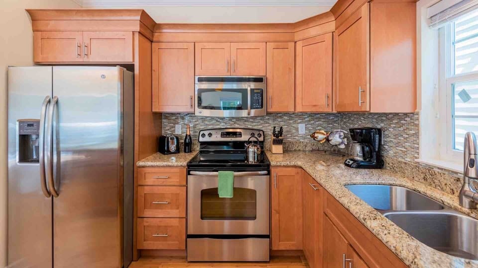 The kitchen has plenty of counter space & comes completely equipped...