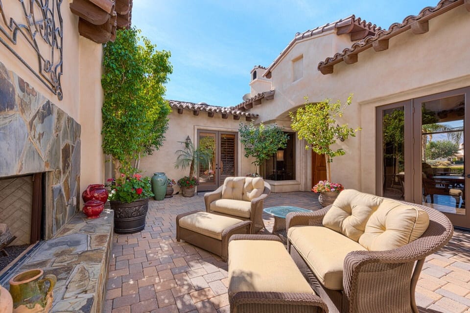 Enjoy the beautiful weather - the outdoor courtyard area with fireplace