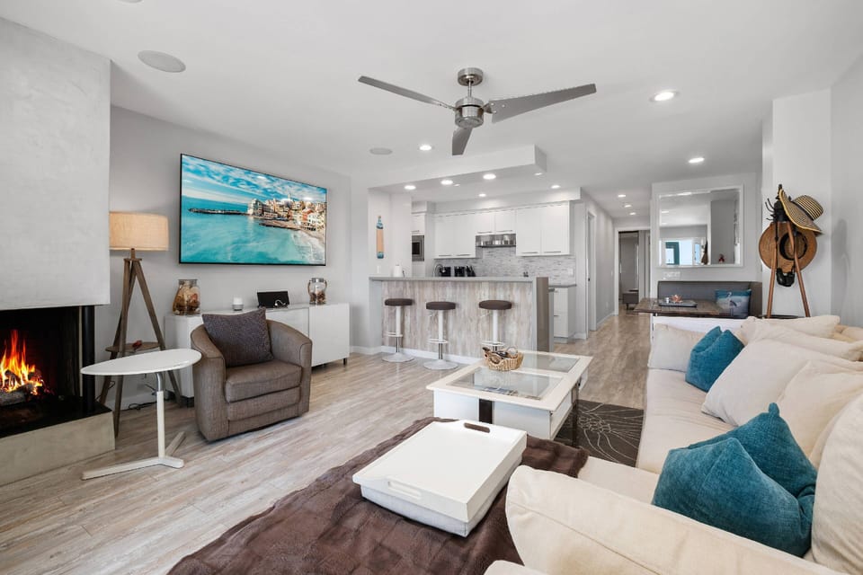 Living room, fireplace and large smart tV