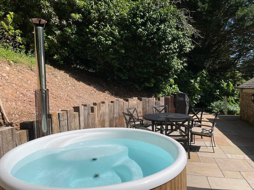 Terrace with wood fired hot tub and outdoor seating