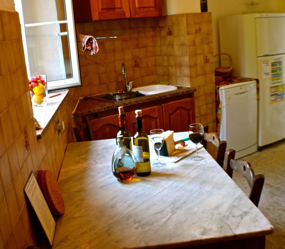 there is space to dine in the kitchen around the traditional marble table