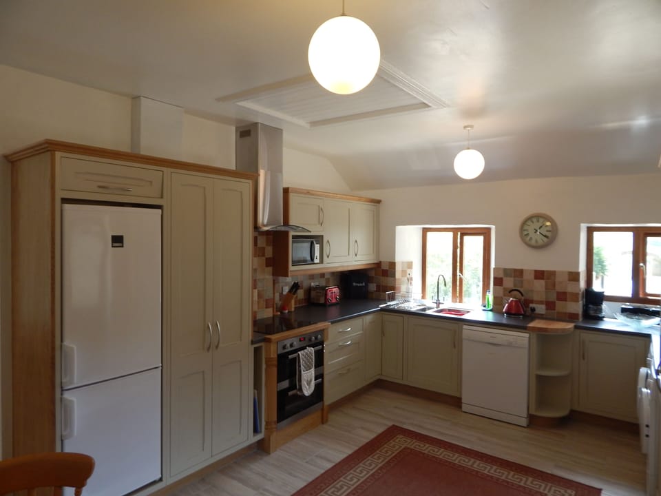 Well equipped kitchen overlooking the garden