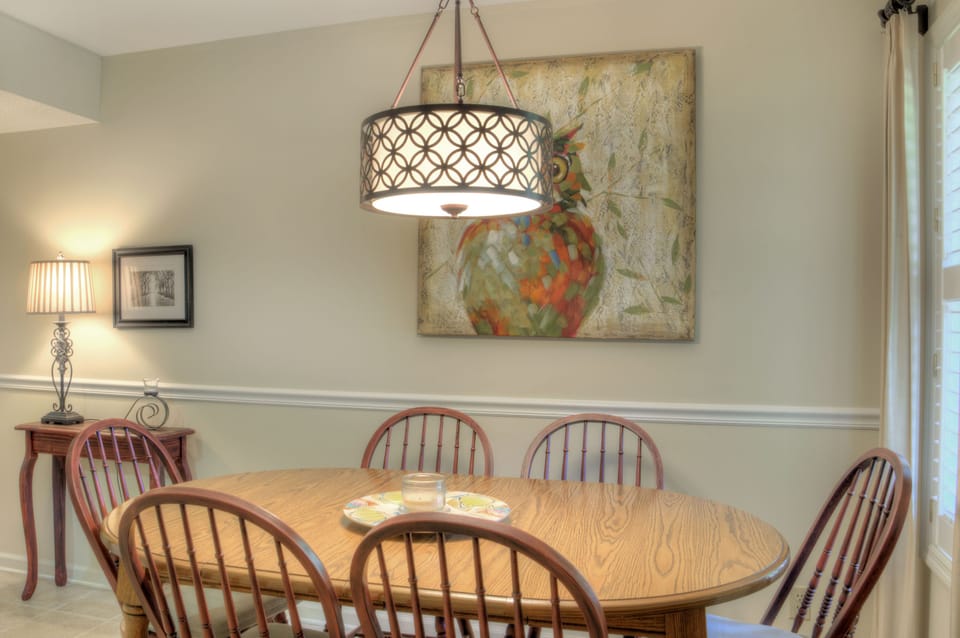 Dining Table with Pendant Light - Dining table with seating for meals, games, or a laptop between plans.