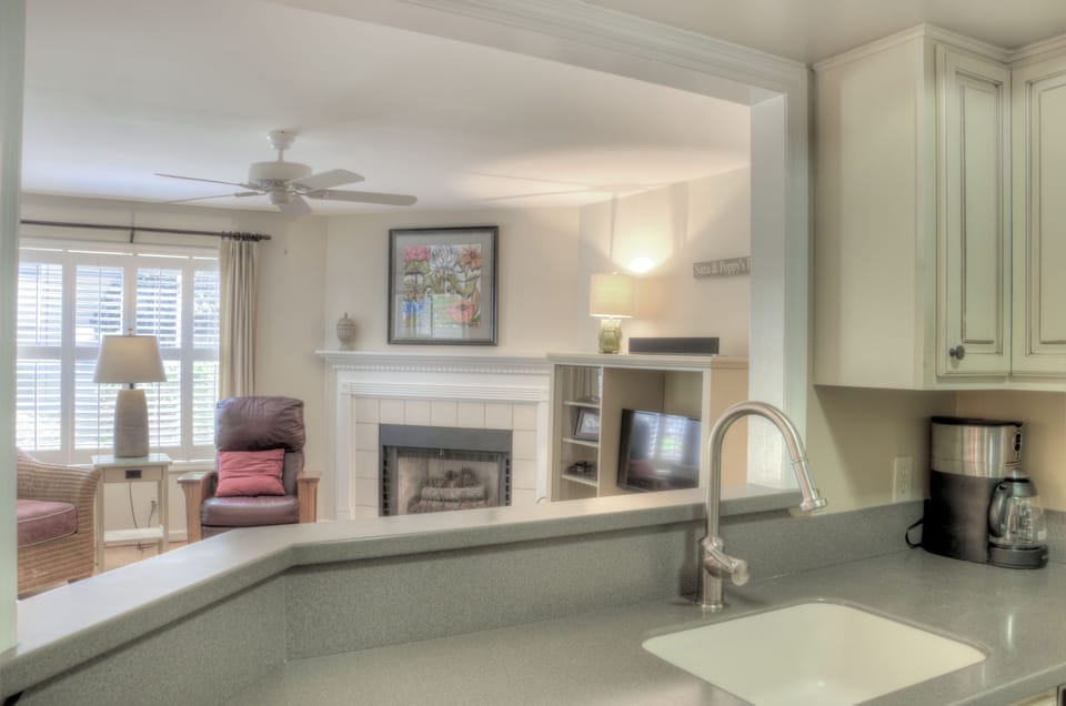 Kitchen Pass-Through to Living Room - Counter-height pass-through keeps the kitchen connected to the living room and dining area.