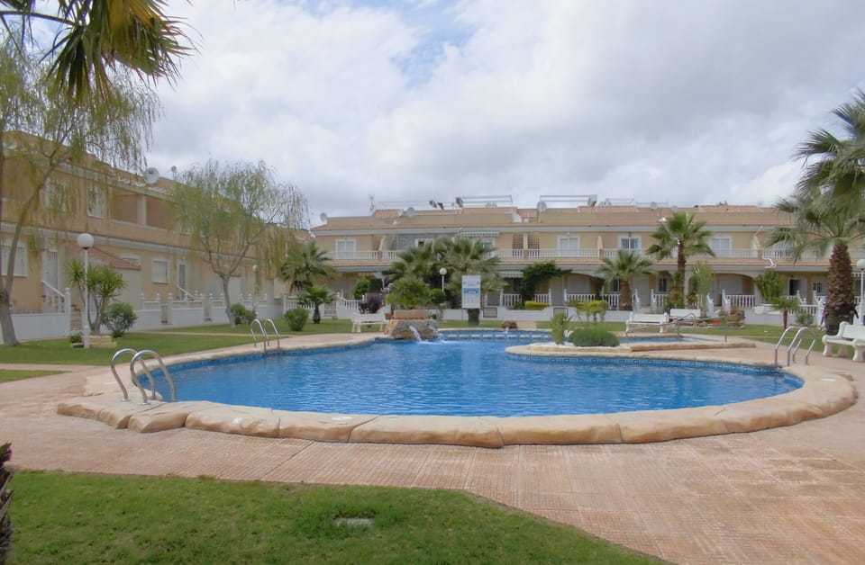 Swimmngpool area.My house is at the end of the left row.
