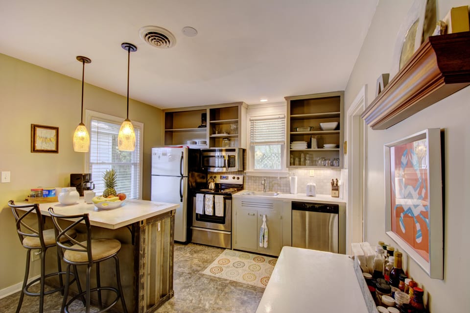 Kitchen Island and Open Shelving - Kitchen includes island seating, open shelving, full-size appliances, and cookware for meals at the cottage.