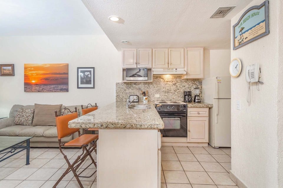 Kitchen with extra high back stools.