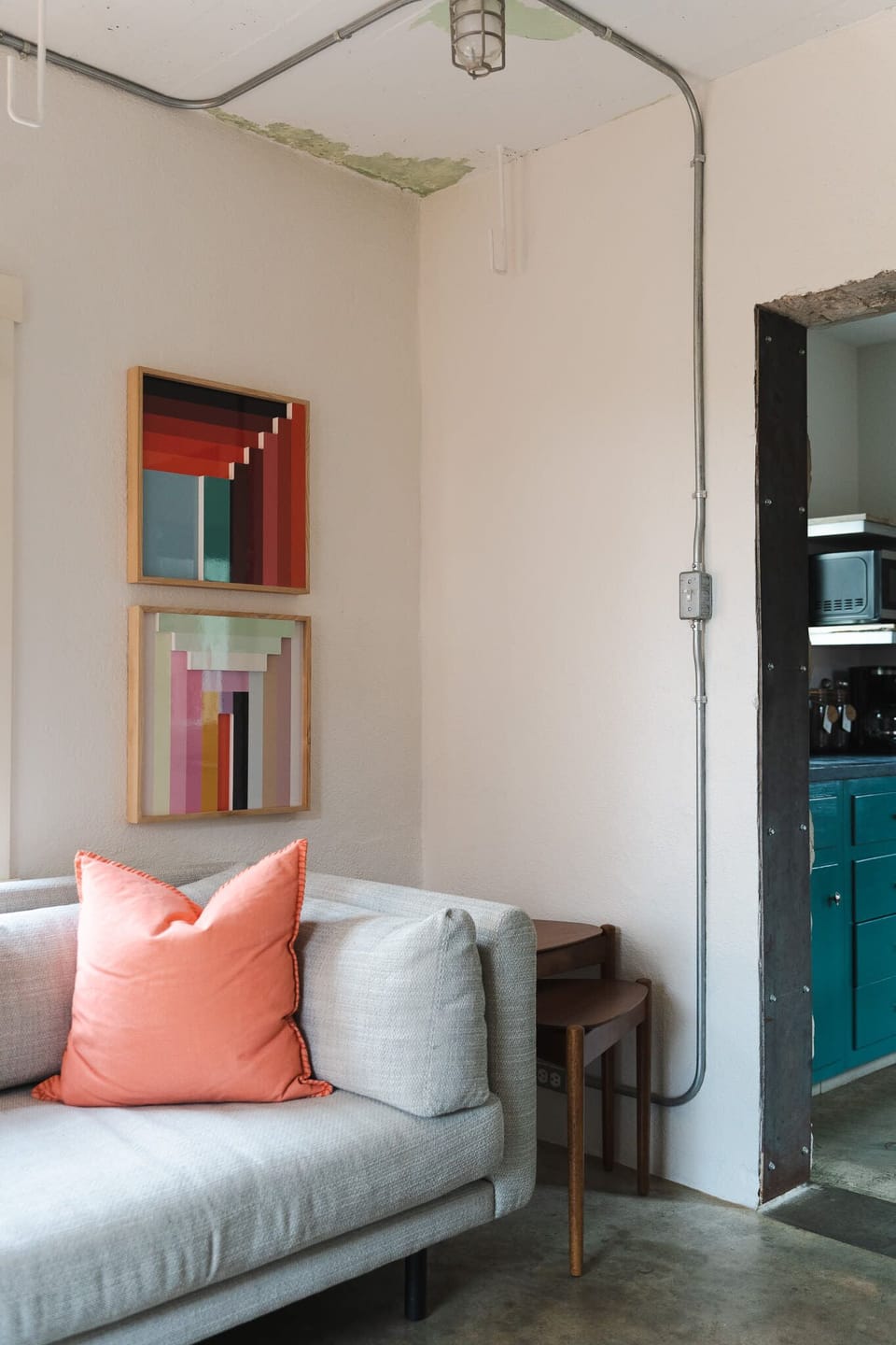 Sofa with modern art – cozy living space with boutique flair.