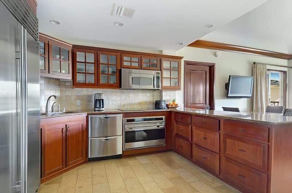 Gourmet kitchen with stainless appliances and granite countertops