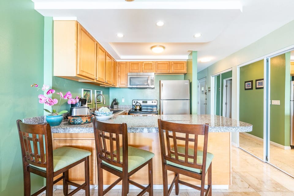 Stainless steel appliances. Full sized refrigerator, stove and dishwasher.